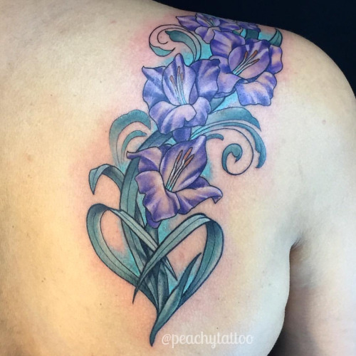 Nice Purple Gladiolus Flowers Tattoo On Shoulder