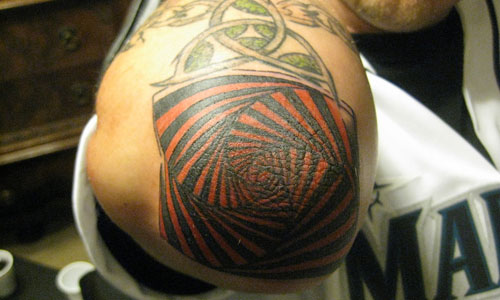 Nice Red Spiral Tattoo On Shoulder