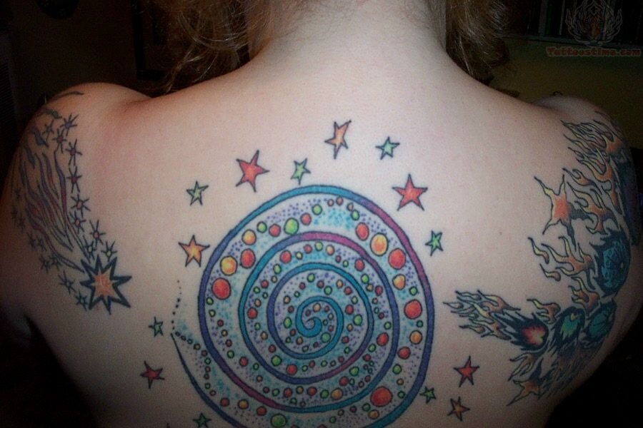 Nice Spiral Circle Tattoo On Upper Back For Girls