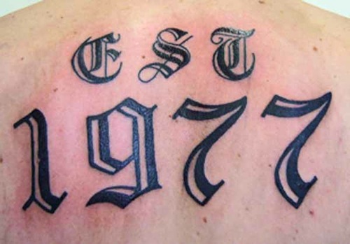 Old Style Number Tattoo On Upper Back