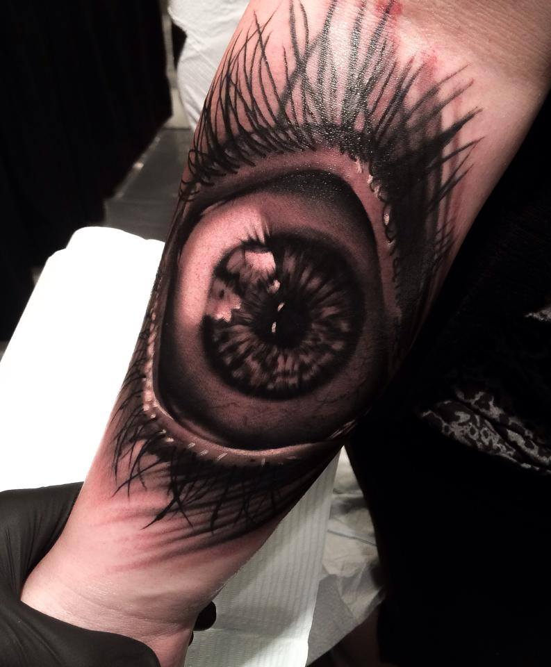 Open eye tattoo on arm by Levi Barnett