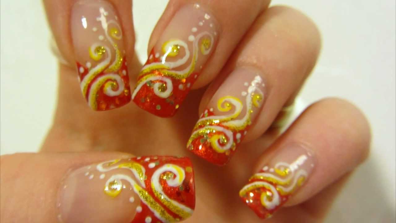 Orange Glitter Tip With Yellow Swirls Design Nail Art