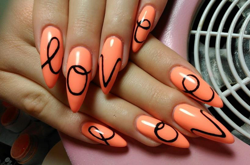 Orange Nails With Black Love Text Nail Art