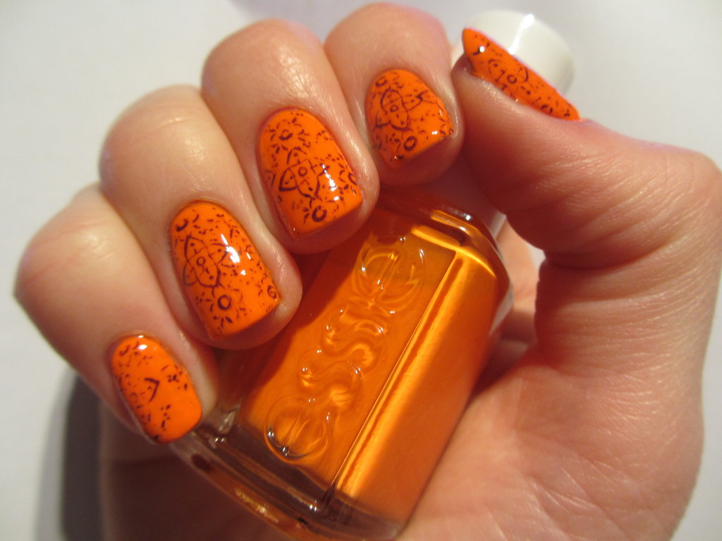 Orange Nails With Flowers Design Idea