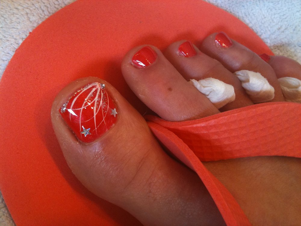 Orange Toe Nail Art With Stars Design
