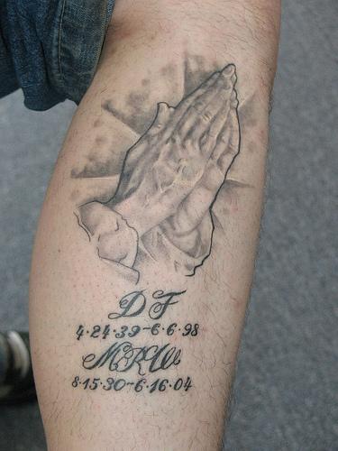 Realistic Color Praying Hands Remembrance Tattoo On Leg