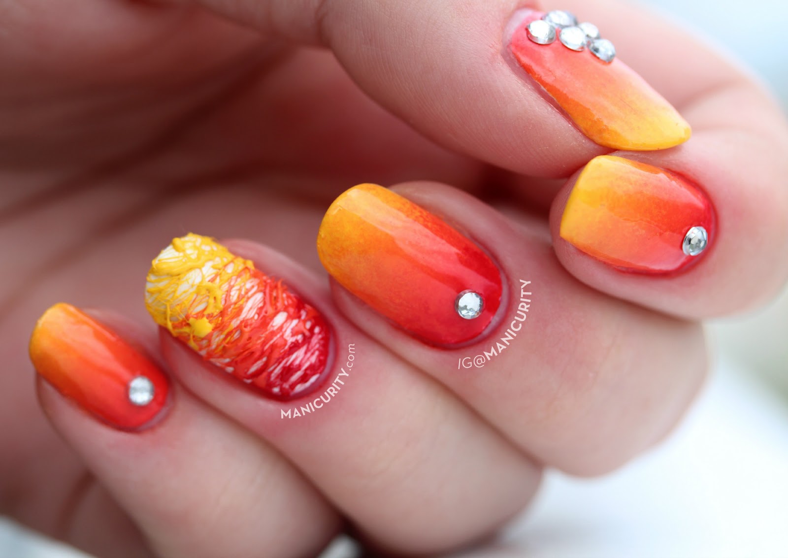 Red And Yellow Gradient Nail Art With Stud Design Idea