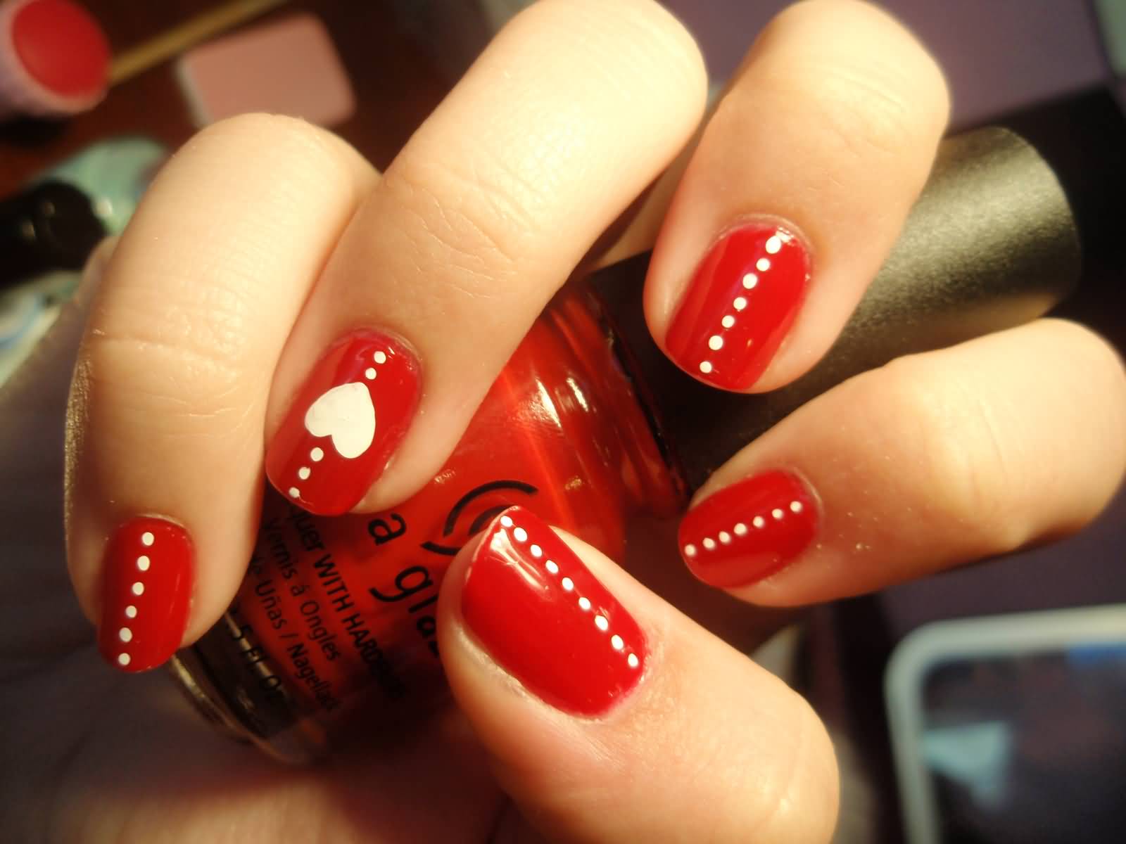 Red Nails With Black Dots And Heart Design Nail Art
