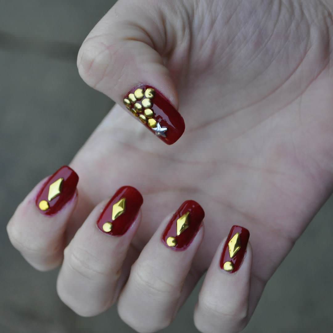 Red Nails With Gold Stud Design Nail Art