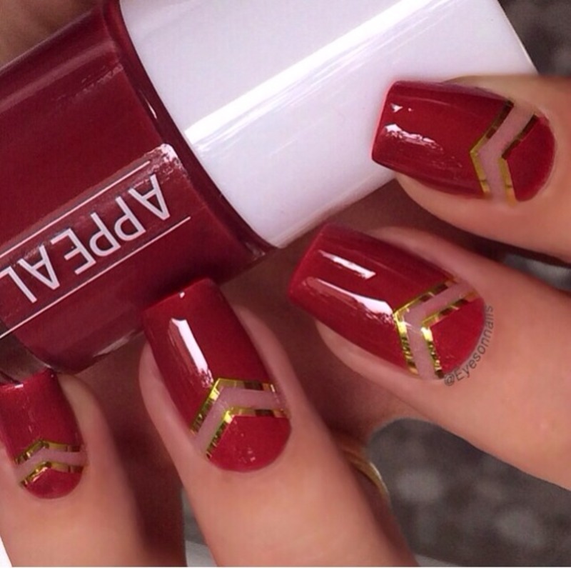 Red Nails With Negative Space And Gold Chevron Design Nail Art