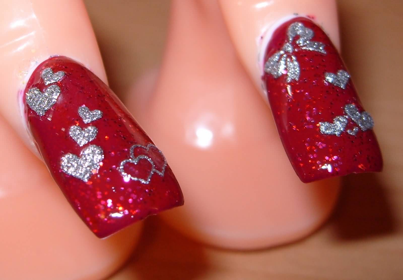 Red Nails With Silver Hearts And Bow Design Nail Art