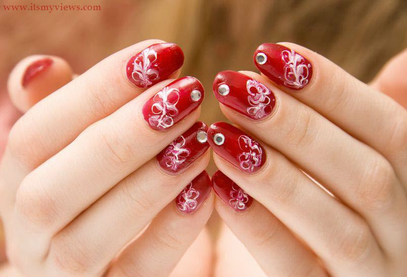 Red Nails With White Flowers And Rhinestones Design Nail Art