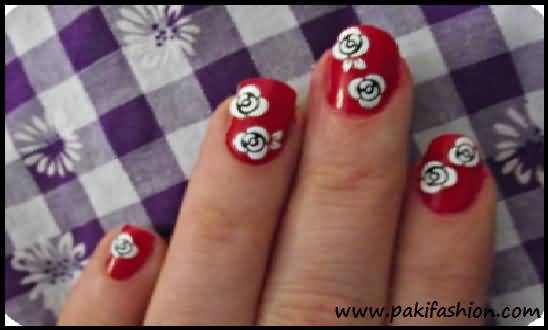 Red Nails With White Flowers Nail Art