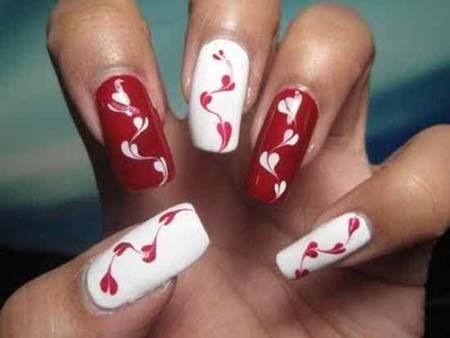 Red Nails With White Trendy Hearts Design Idea