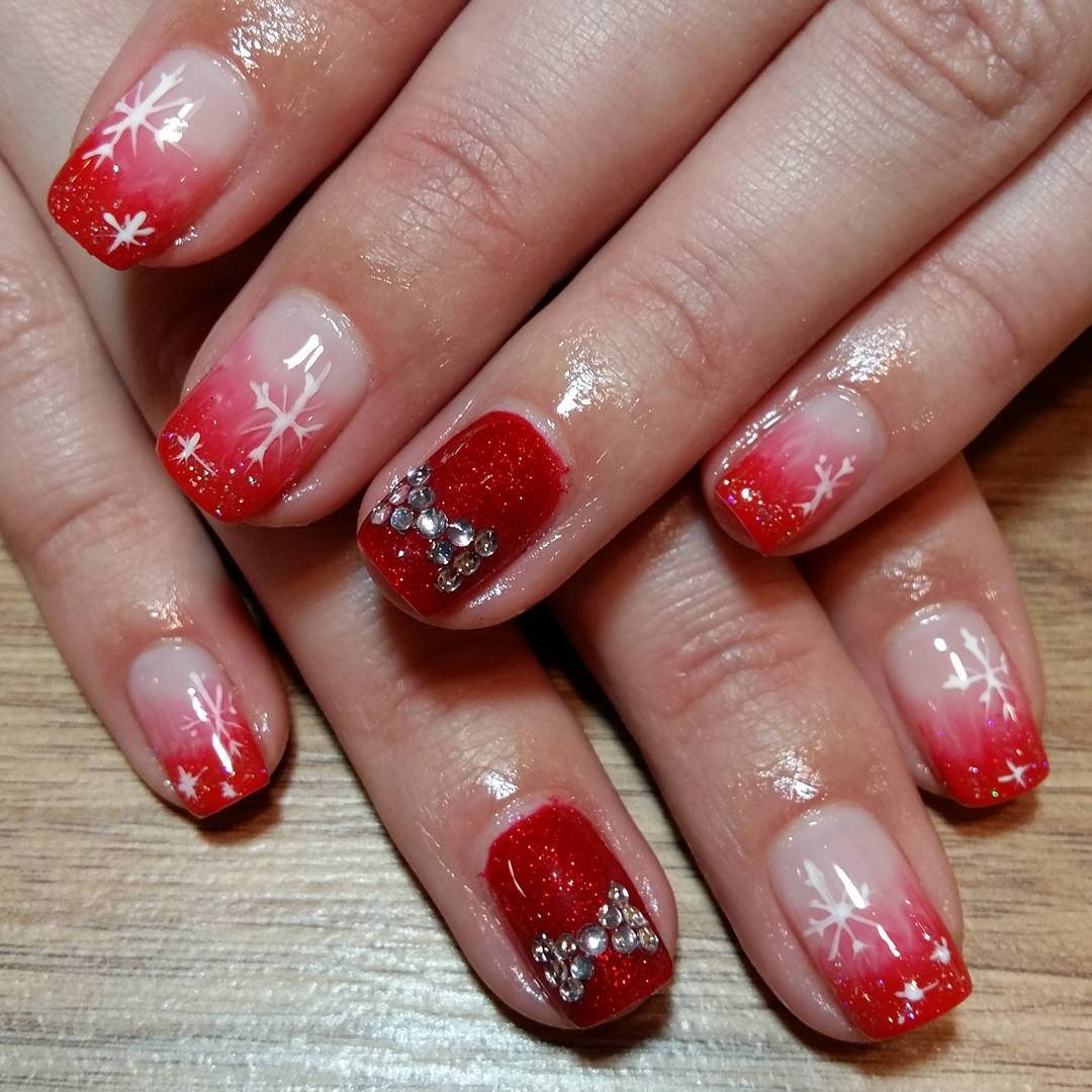 Red Nails With Snowflakes And Rhinestones Bow Design Nail Art