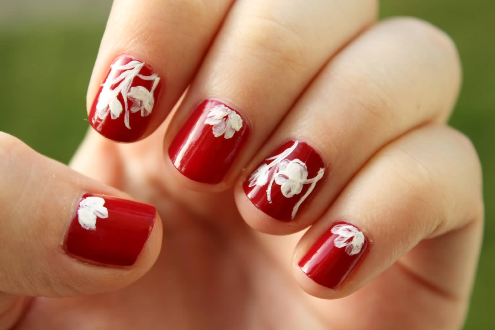 Red Short Nails With White Floral Design Nail Art