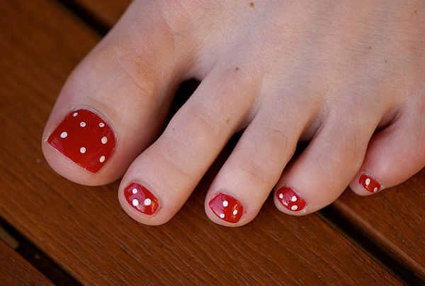 Red Toe Nails With White Dots Design