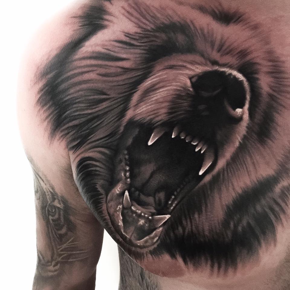 Roaring bear tattoo on chest
