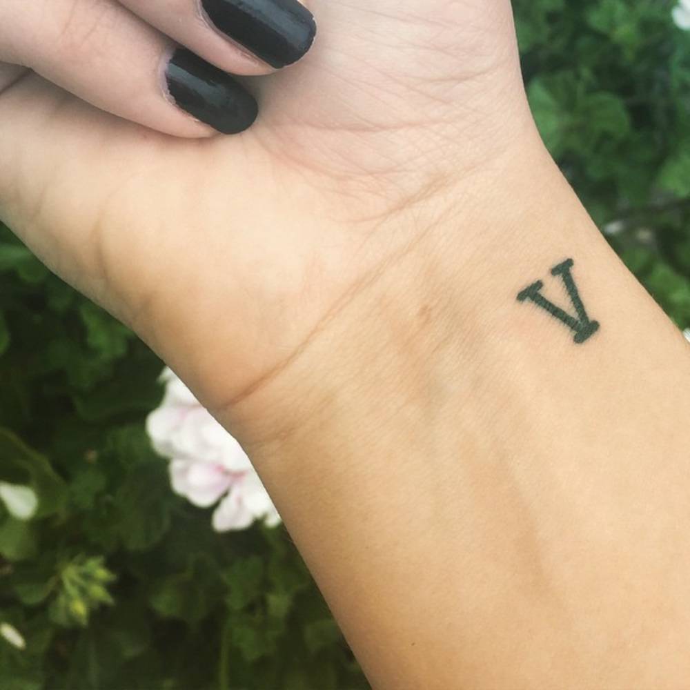 Roman Number Five Tattoo On Wrist For Girls