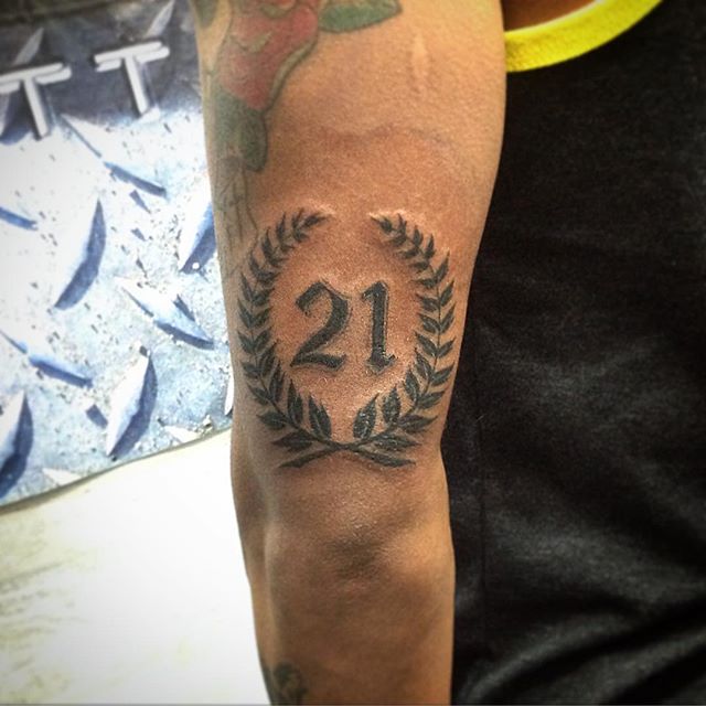 Rome Style 21 Number Tattoo On Triceps