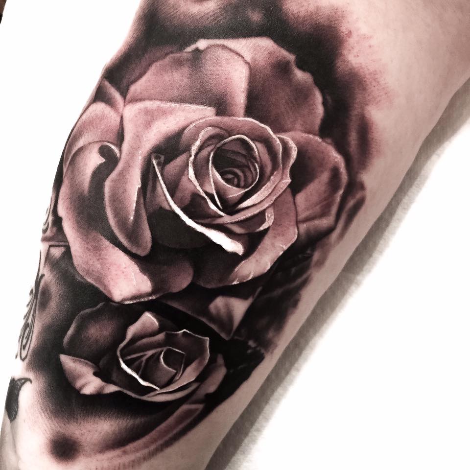 Rose tattoo on arm by Levi Barnett