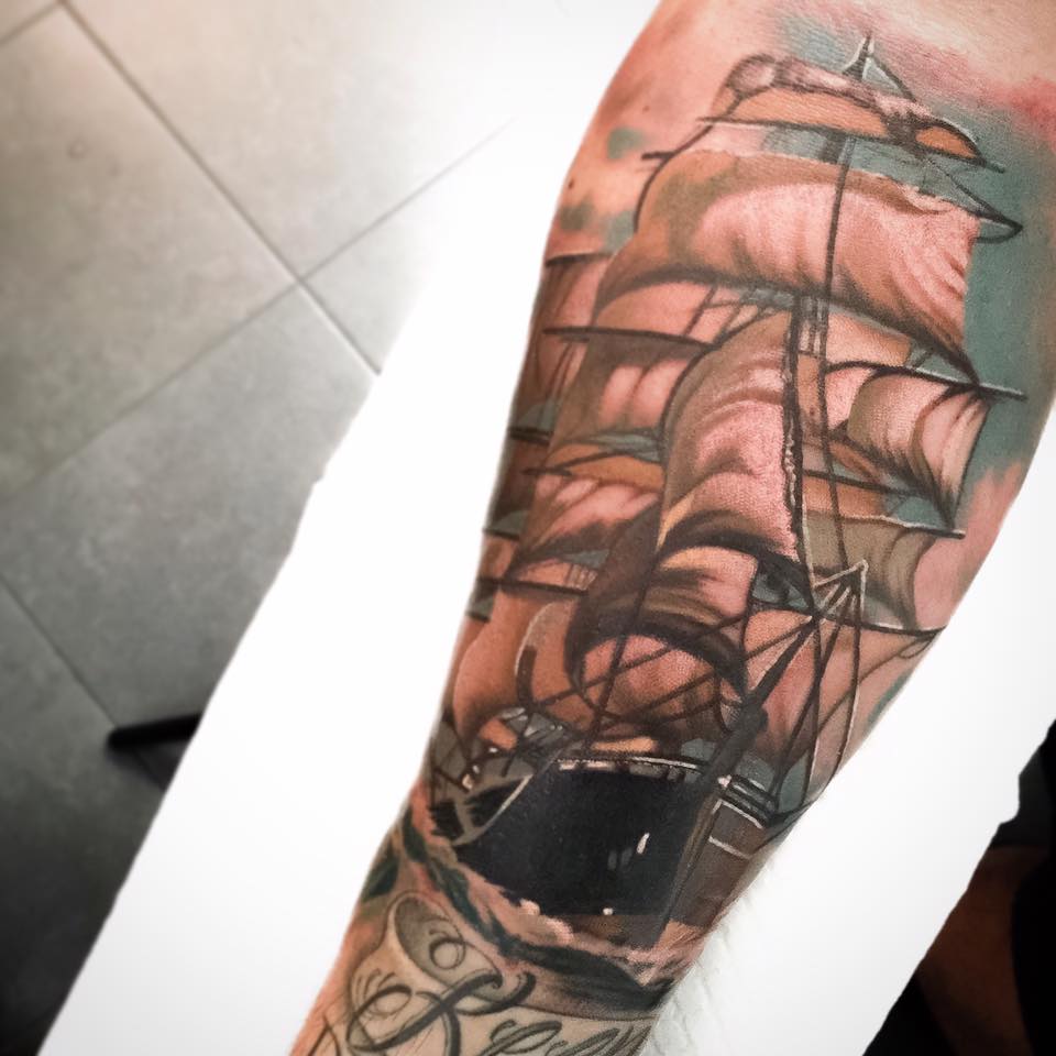 Sailor ship tattoo on arm