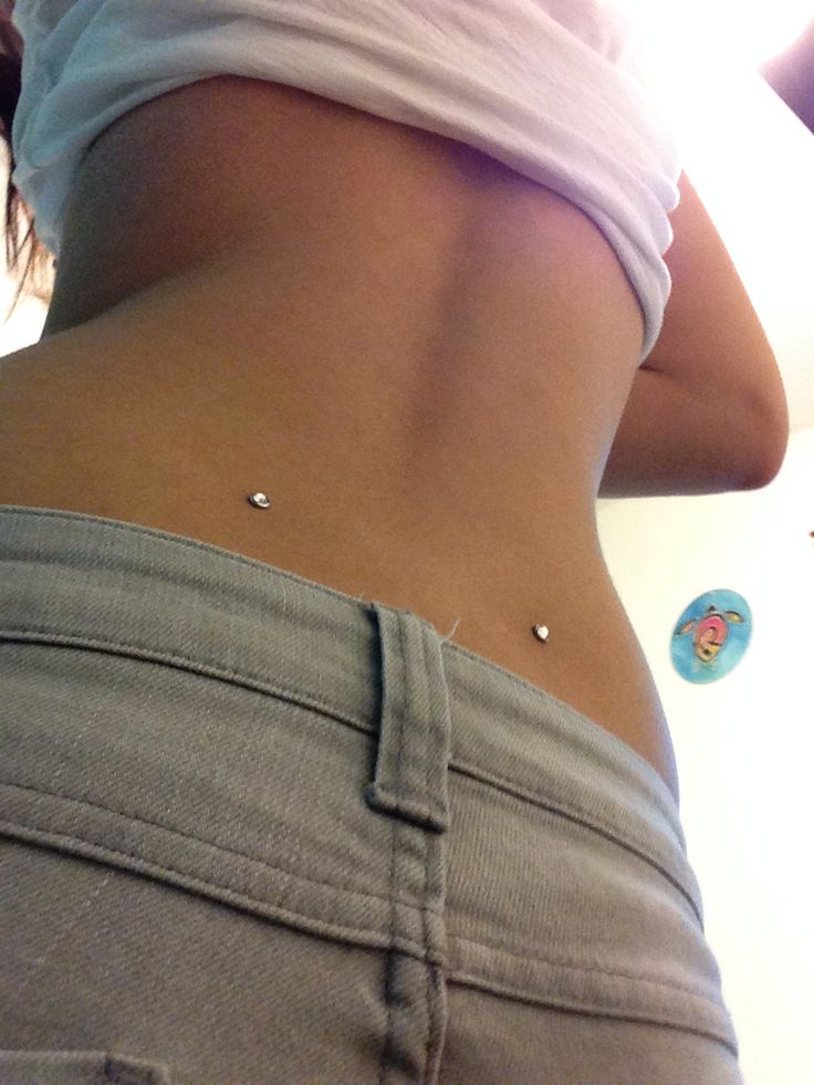 Silver Anchors Lower Back Piercing Picture For Girls
