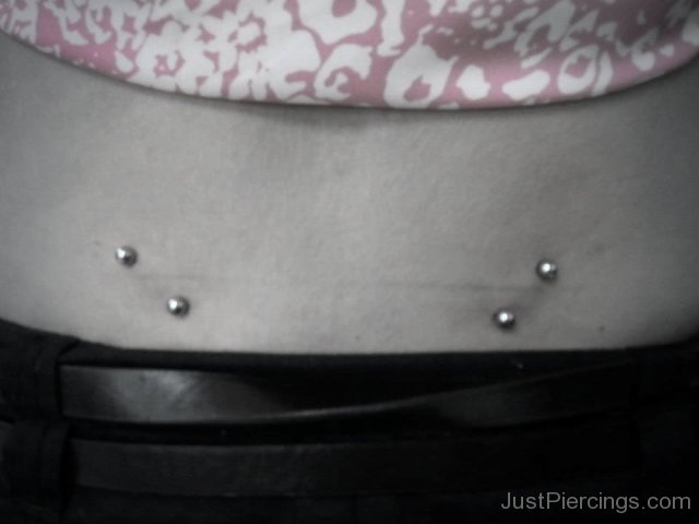 Silver Barbells Lower Back Piercing For Young Girls