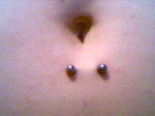 Simple Surface Navel Piercing With Barbell