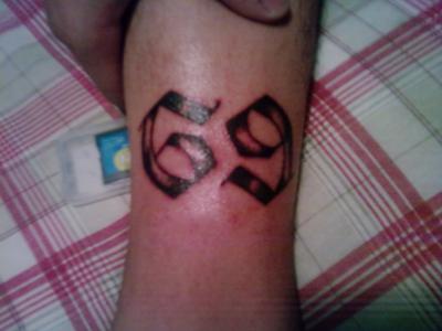 Sixty Nine Number Tattoo On Arm