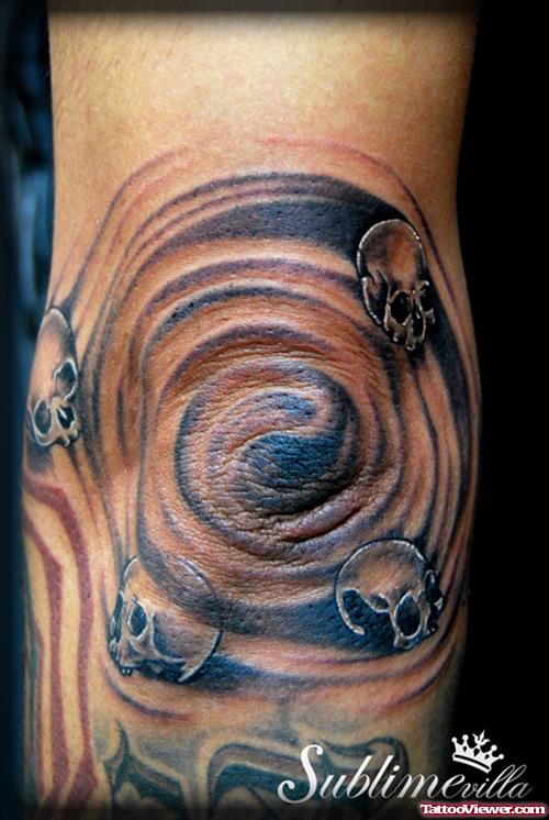 Skulls Spiral Tattoo On Elbow
