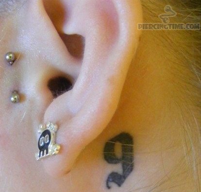 Small Black Nine Number Tattoo On Behind Ear For Girls