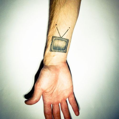 Small Black Television Tattoo On Wrist