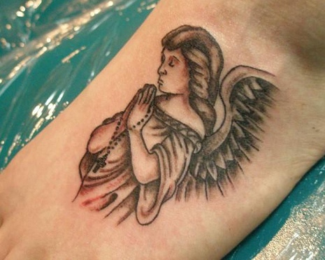 Small Grey Praying Angel Tattoo On Foot