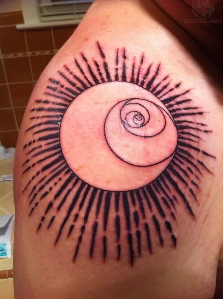 Spiral Eye And Sun Tattoo On Right Shoulder
