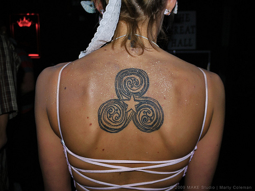 Star Celtic Spiral Tattoo On Upper Back For Girls