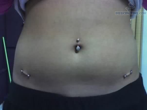 Surface Hips And Surface Navel Piercing