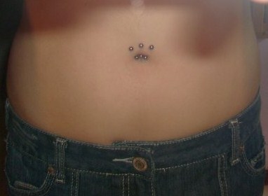 Surface Navel Piercing With Small Silver Barbells