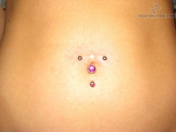 Surface Navel With Pink Studs