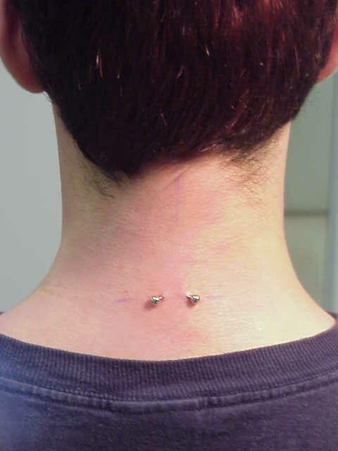Surface Neck Piercing With Small Curved Barbell