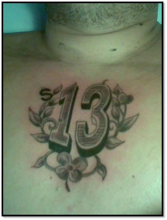 Thirteen Symbol Number Tattoo On Chest