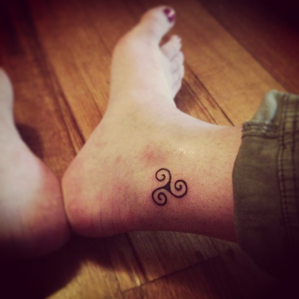 Tiny Triple Spiral Tattoo On Ankle