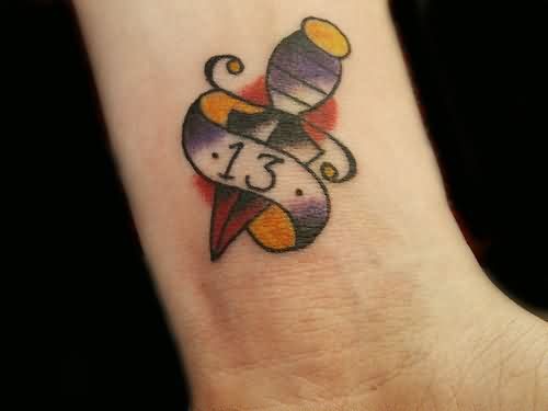 Traditional Thirteen And Dagger Number Tattoo On Wrist