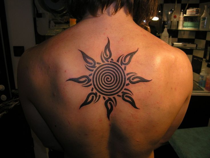 Tribal Spiral Sun Tattoo On Upper Back