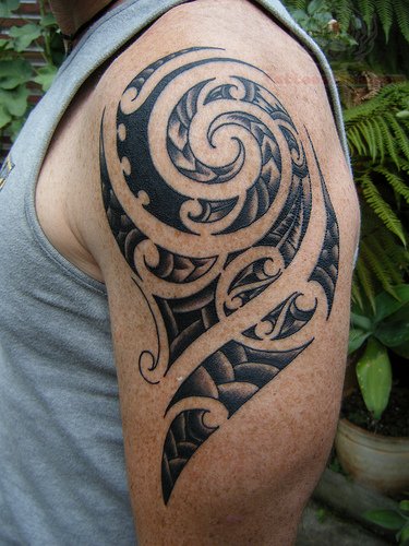 Tribal Spiral Tattoo On Left Half Sleeve For Men
