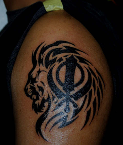Tribal Tiger Khanda Symbol Tattoo On Left Shoulder By The Red Parlour Tattoo