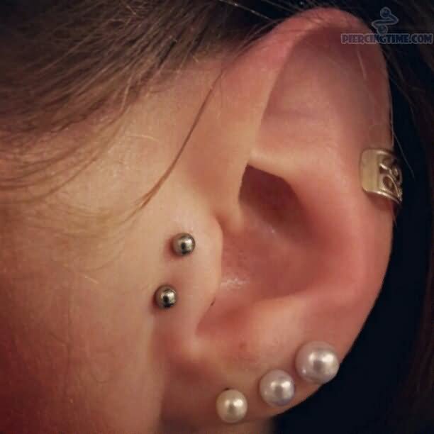 Triple Ear Lobe And Surface Ear Piercing With Silver Barbell