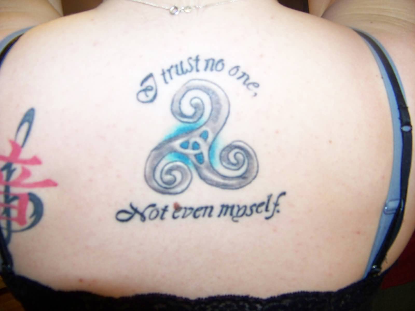 Triple Spiral With Lettering Tattoo On Upper Back