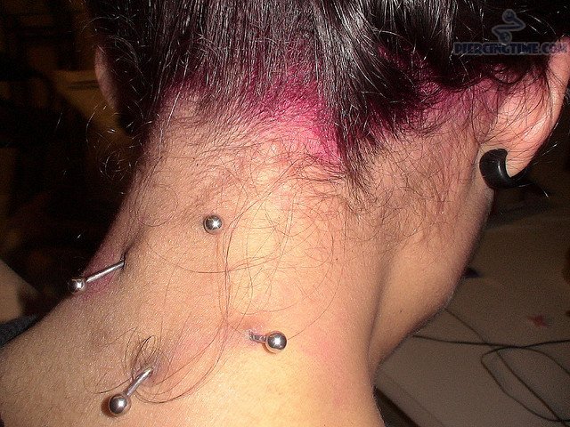 Unique Surface Neck Piercing With Barbells