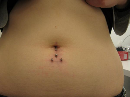 Vertical And Horizontal Surface Navel Piercings For Girls